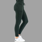 Three-quarter view of women's scrub joggers 920 super stretch bottle green showing side pockets.