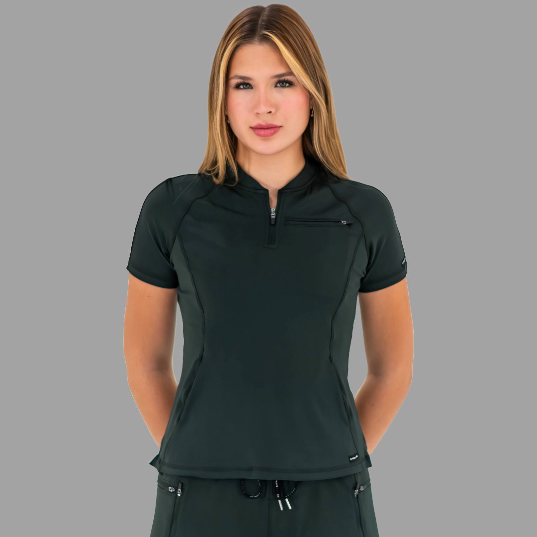Woman standing straight facing forward wearing a bottle green 920 super stretch scrub top.