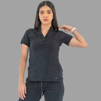 Women's black Style 930 scrub top, front view with hand on shoulder