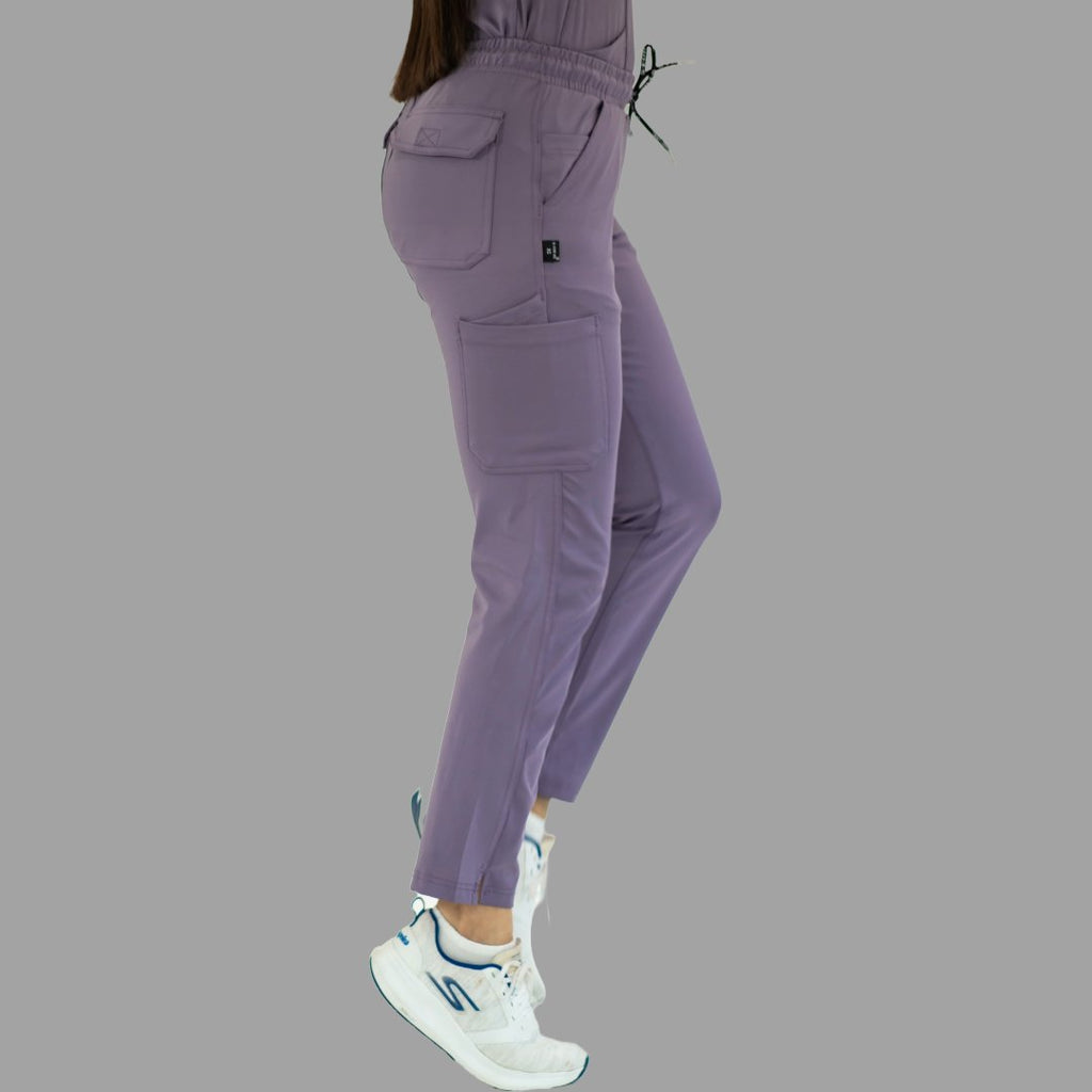 Women's light purple Style 930 scrub pants, three-quarter back view showing pocket details.