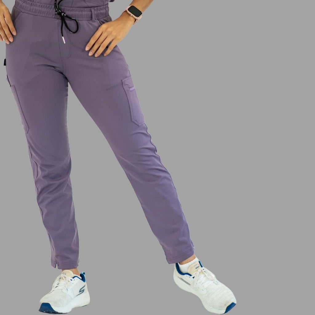 Women's light purple Style 930 scrub pants, front view with hand on hip.
