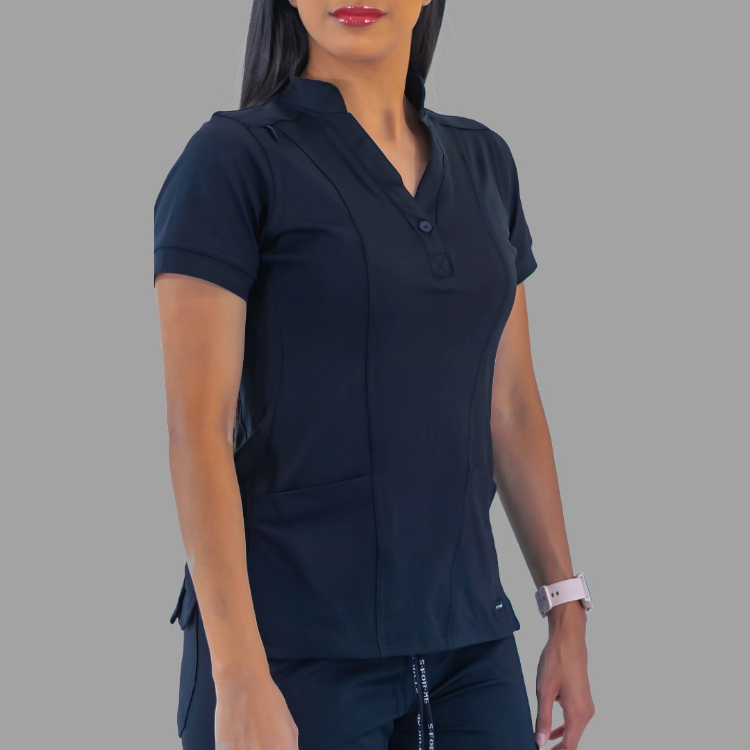 Front view of a woman modeling the navy blue Style 930 scrub top, showing the split neckline and short sleeves.