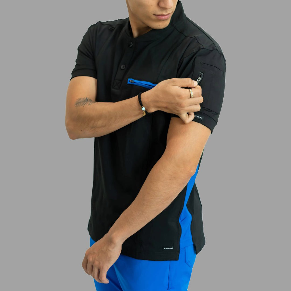 Close-up of Men’s 930 scrub top showing mandarin collar, short sleeve and Royal Blue pocket accent.