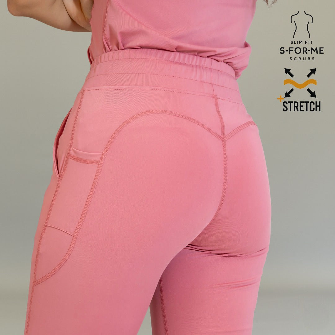 Pantalón quirúrgico palo de rosa para mujer con ajuste favorecedor en cadera